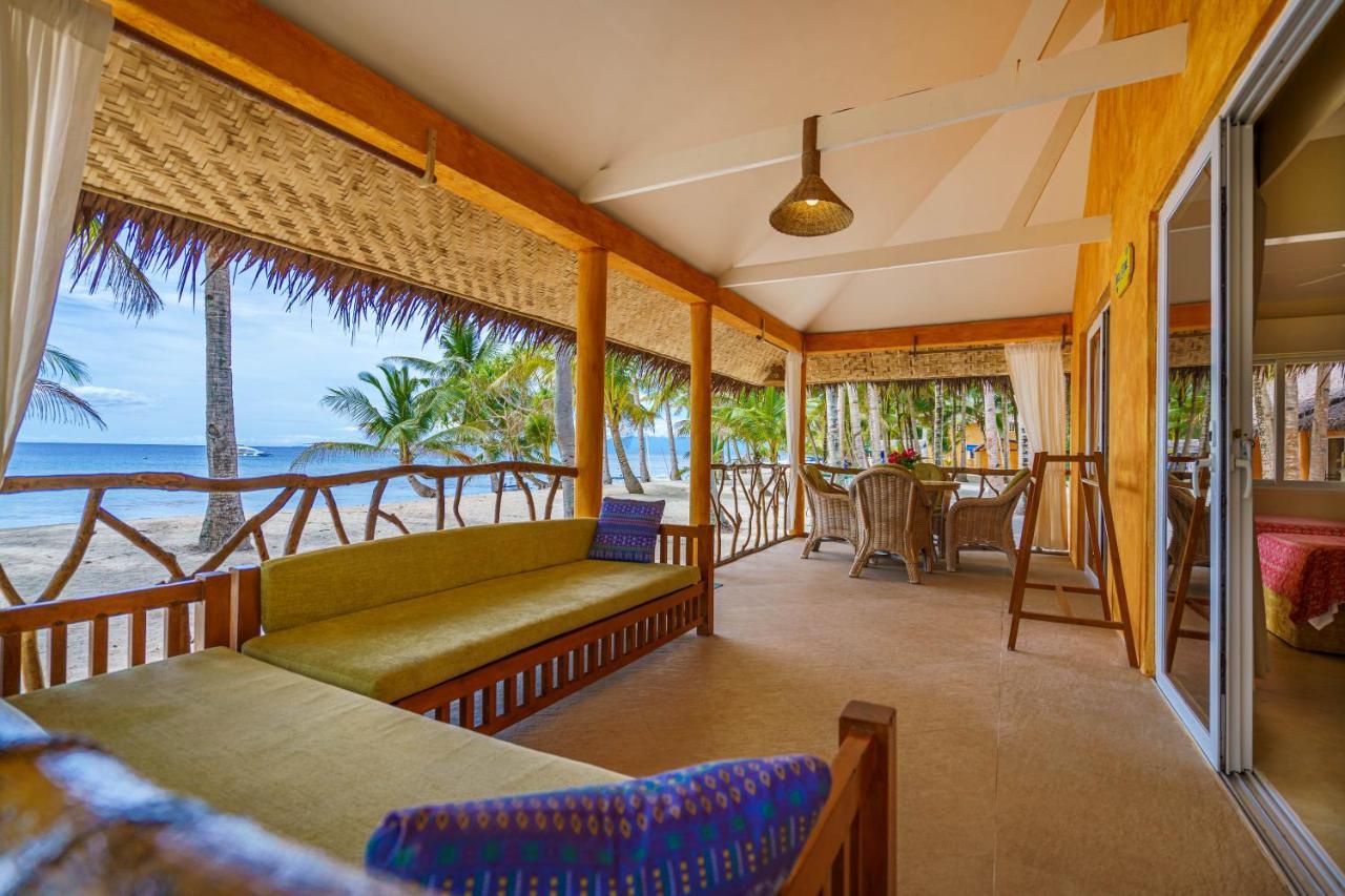 Coco Grove Beach Resort, Siquijor Island Dış mekan fotoğraf A view of the beach from the hotel