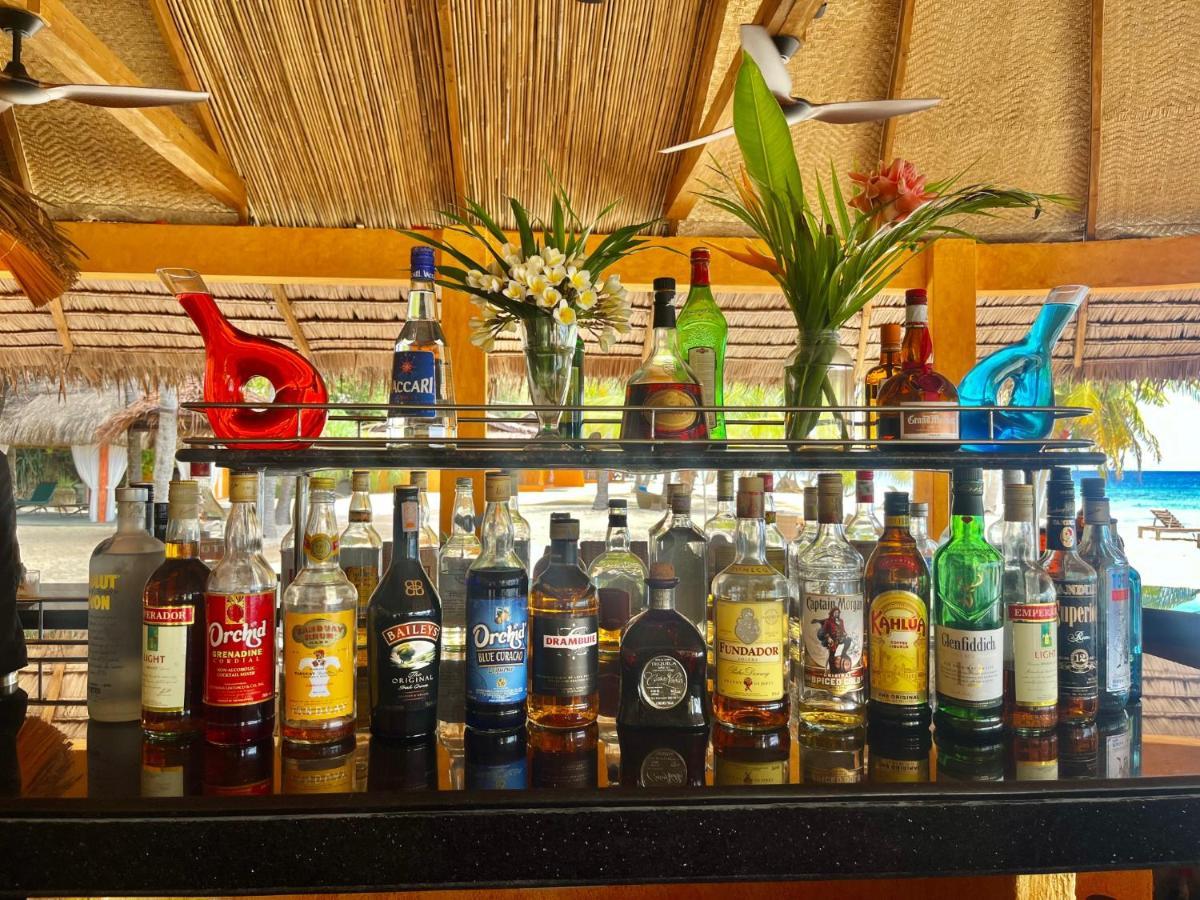 Coco Grove Beach Resort, Siquijor Island Dış mekan fotoğraf Rum bottles at a bar in the Caribbean